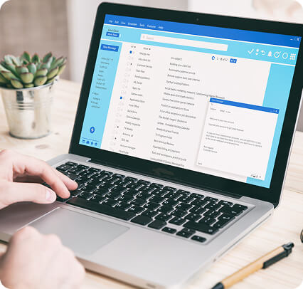 Close up view of a person looking at emails on their laptop